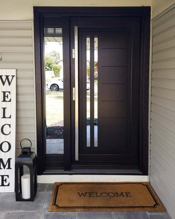 Stylish Main Door with full length bar handle, reflective glass incorporated in the panel and the sidelight