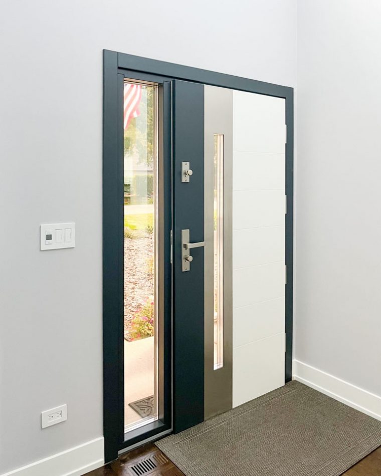 Front door of a house with single sidelight incorporated with glass.