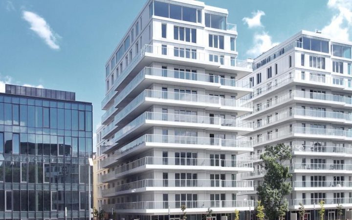 A modern residential place with veranda for every floor, enclosed in metal railings and glass framing